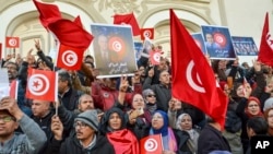 FILE: People protest against president Kais Saied policies, in Tunis, Tunisia, March 5, 2023. Thousands of people marched through Tunisia's capital March 4, decrying an expanding crackdown on opposition voices and a proposed lifting of subsidies for food and other goods.
