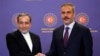 Iranian Foreign Minister Abbas Araqchi, left, shakes hands with his Turkish counterpart, Hakan Fidan, during a joint press conference in Istanbul on Oct. 19, 2024.