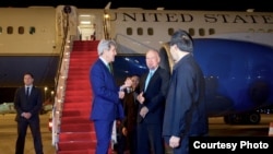 U.S. Secretary of State John Kerry chats with Laotian officials and U.S. Ambassador to Laos Daniel Clune as he arrives at Vientiane Wattay International Airport, Jan. 24, 2016. (State Department)