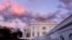 FILE - The White House is seen at sunset in Washington, Jan. 26, 2024. President Joe Biden plans to welcome Kenyan President William Ruto to the White House in May, hosting a state visit after reneging on his promise to visit Africa last year. 