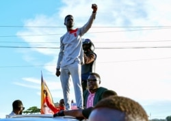 FILE - Ugandan pop star and presidential candidate Robert Kyagulanyi, also known as Bobi Wine, campaigns near Kampala, Uganda, Nov. 30, 2020.