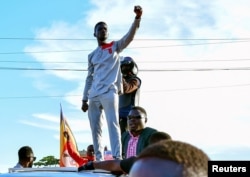 FILE - Ugandan pop star and presidential candidate Robert Kyagulanyi, also known as Bobi Wine, campaigns near Kampala, Uganda, Nov. 30, 2020.