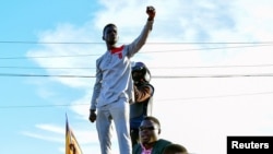 FILE - Ugandan pop star and presidential candidate Robert Kyagulanyi, also known as Bobi Wine, campaigns near Kampala, Uganda, Nov. 30, 2020.