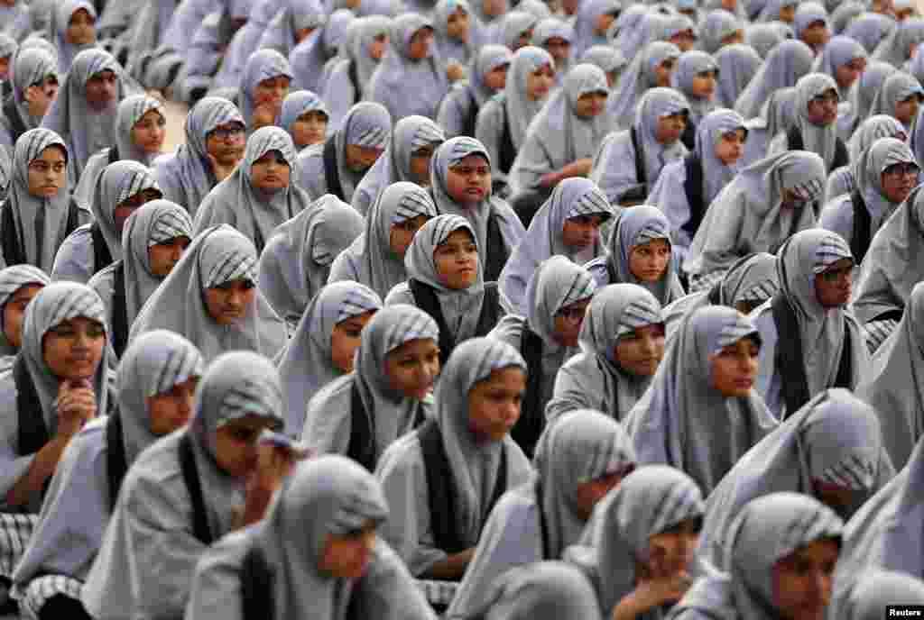 School girls listen to their teacher (not pictured) during a lecture on the Article 370, a special constitutional status for Kashmir which was scrapped by the Indian government last month, to mark Prime Minister Narendra Modi's birthday at a school in Ahm