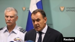 Greek Defense Minister Nikos Panagiotopoulos speaks during a press conference in Nicosia, Cyprus, July 19, 2019. 