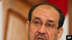 Iraqi Prime Minister Nuri al-Maliki holds a press conference in Baghdad as he called for a dialogue with rival blocs to gauge whether or not US troops currently in Iraq should stay beyond a year-end deadline for their withdrawal, May 11, 2011