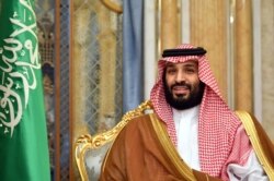 FILE - Saudi Arabia's Crown Prince Mohammed bin Salman attends a meeting with U.S. Secretary of State Mike Pompeo in Jeddah, Saudi Arabia, Sept. 18, 2019.