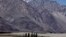 Tourists ride double hump camels at Nubra valley, in Ladakh, India, July 2011.