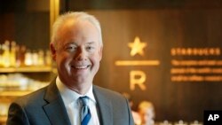 Kevin Johnson, CEO of Starbucks, poses for a photo in the company's Starbucks Reserve store, located in the company's headquarters building in Seattle's SODO neighborhood, March 5, 2019.