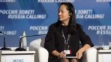 FILE - Meng Wanzhou, executive board director of the Chinese technology giant Huawei, attends a session of the VTB Capital Investment Forum "Russia Calling!" in Moscow, Russia Oct. 2, 2014. 