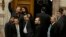 FILE - Lawmakers from the extreme right Golden Dawn party, shown outside parliament in Athens, and its leader will stand trial on criminal charges of participating in a criminal group, a judicial panel ruled Feb. 4, 2015.