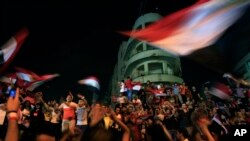 Opponents of Egypt's Islamist leader Mohamed Morsi celebrate outside the presidential palace in Cairo, July 3, 2013.