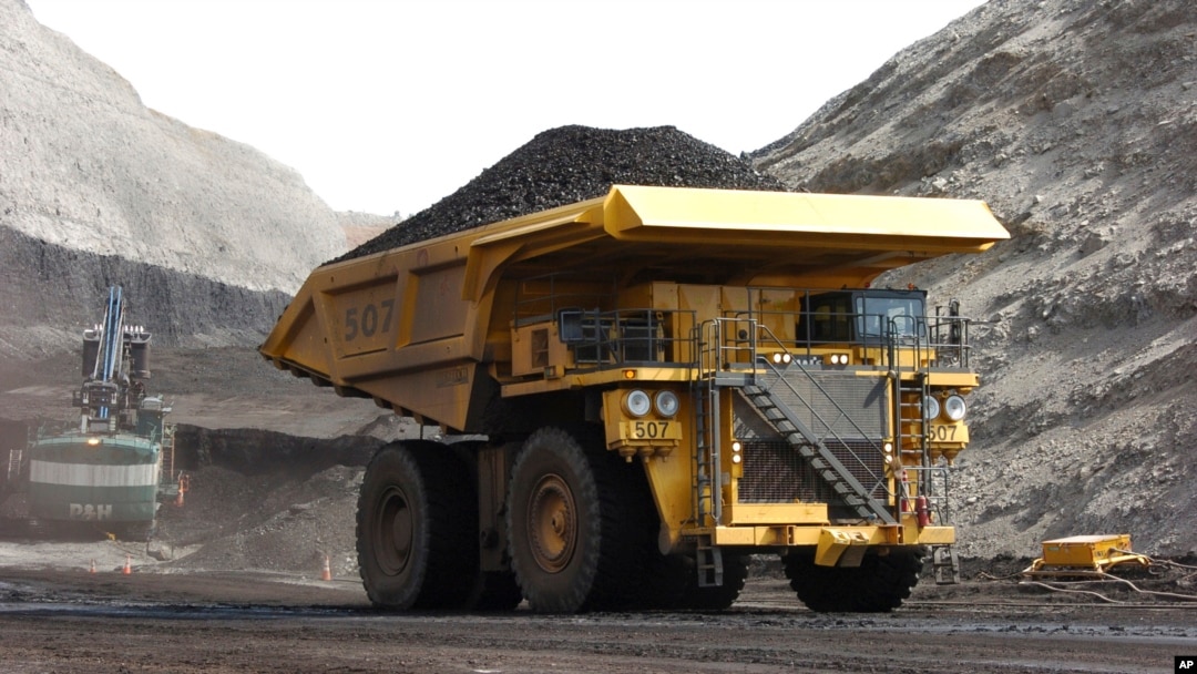 FILE - A mining truck hauls coal at Cloud Peak Energy's Spring Creek strip mine near Decker, Mont. The Northern Cheyenne Tribe challenged the Trump administration decision to life a moratorium on coal leases. The neighboring Crow tribe supports the decision. 