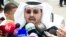 Laywer Ali al Ali speaks to the media in Kuwait City, June 16, 2013, after leaving the courthouse to announce the court's decision to dissolve parliament. 