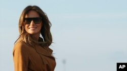 First lady Melania Trump boards a plane, Monday, Oct. 1, 2018, in Andrews Air Force Base, Maryland, en route to Africa. 