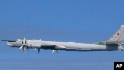 This image released by Joint Staff, Ministry of Defense, shows a Russian Tu-95 bomber which they said were flying near the Sea of Japan, July 23, 2019. 