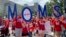 Members of Moms Demand Action march in support of teachers, May 1, 2019, during a teacher rally, in Raleigh, North Carolina.