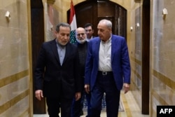 Iran’ian Foreign Minister Abbas Araghchi, left, and Lebanon’'s Parliament Speaker Nabih Berri leave after their meeting in Beirut, Oct. 4, 2024. Araghchi vowed support for Tehran's 'friends' in Lebanon.