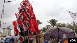 Iraqi flags resembling a tree adorn Tahrir Square, in Baghdad, which has been occupied by protesters for months, on Jan. 21, 2020. (Heather Murdock/VOA)