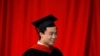 FILE - Bo Guagua, son of fallen Chinese politician Bo Xilai, walks offstage after receiving his master's degree in public policy at the John F. Kennedy School of Government at Harvard University in Cambridge, Massachusetts May 24, 2012.