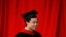 FILE - Bo Guagua, son of fallen Chinese politician Bo Xilai, walks offstage after receiving his master's degree in public policy at the John F. Kennedy School of Government at Harvard University in Cambridge, Massachusetts May 24, 2012.