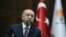 FILE - Turkish President Recep Tayyip Erdogan addresses lawmakers from his ruling AK Party during a meeting at the parliament in Ankara, Turkey, Nov. 26, 2019. (Presidential Press Office/Handout)