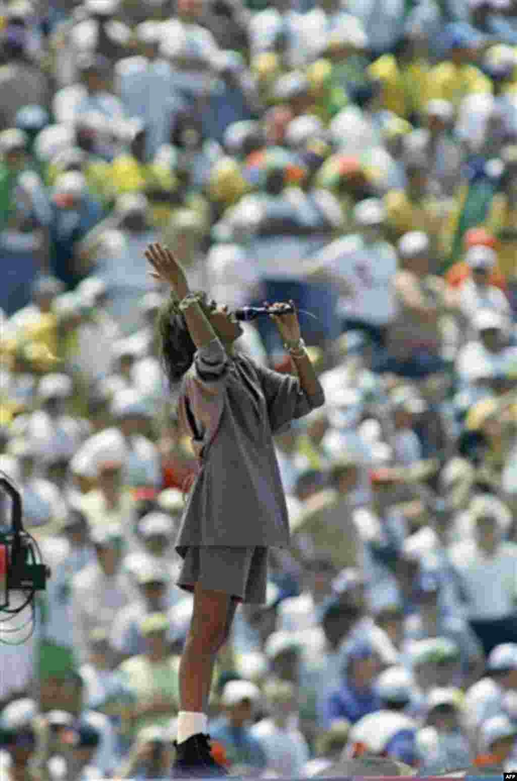 FILE - In this July 17, 1994, file photo, Whitney Houston performs before a sellout crowd at the Rose Bowl in Pasadena, Calif., during closing ceremonies for the final match that pits Italy against Brazil in the World Cup. Publicist Kristen Foster said, S