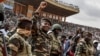 General Abdourahamane Tchiani, second from left, the head of the military regime in Niger, greets thousands who gathered in Niamey to celebrate the first anniversary of his coming to power after the July 26, 2023, coup that overthrew civilian president Mohamed Bazoum. 