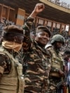 General Abdourahamane Tchiani, second from left, the head of the military regime in Niger, greets thousands who gathered in Niamey to celebrate the first anniversary of his coming to power after the July 26, 2023, coup that overthrew civilian president Mohamed Bazoum. 