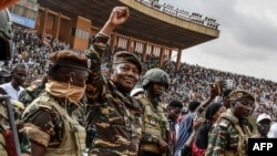 FILE - General Abdourahamane Tiani (2nd L), the head of the military regime in Niger, greets the thousands of people who gathered in Niamey for the launch of festivities marking the first anniversary of his coming to power after a July 26, 2023 coup.