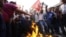 Members of Nepal Student Union affiliated with Nepali Congress chant slogans while they burn an effigy of Prime Minister Baburam Bhattarai in Katmandu, Nepal, May 31, 2012.
