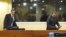 Bosnian Serbs Milan Lukic (L) and Sredoje Lukic (R) sit in the courtroom to attend the appeals verdict in their trial for war crimes in the former Yugoslavia, at the International Criminal Tribunal in The Hague, December 4, 2012.