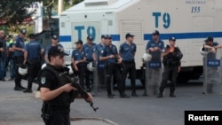 FILE - Turkish riot police stand guard in front of a local branch of the pro-Kurdish Peoples' Democratic Party (HDP) in Diyarbakir, Turkey, July 8, 2019. 