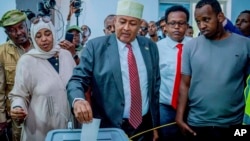 FILE - Abdirahman Mohamed Abdullahi, center, casts his vote inside a polling station during the presidential election in Hargeisa, Somaliland, Wednesday, Nov. 13,2024. 