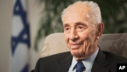 FILE - Former Israeli President Shimon Peres speaks during an interview with The Associated Press in Jerusalem, Nov. 2, 2015.