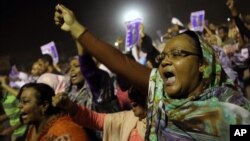 Sudanese anti-government protesters chant slogans during a demonstration in Khartoum, Sudan, Sunday, Sept. 29, 2013. 