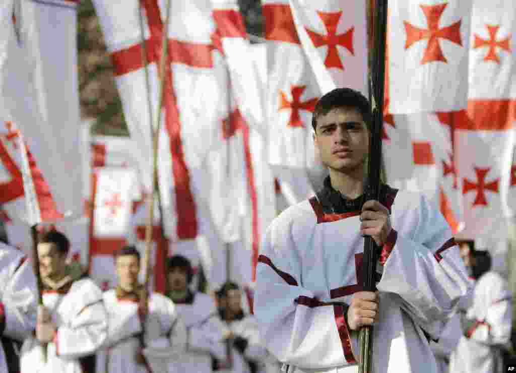 Participants march with national flags during "Alilo", a religious procession, to celebrate the Orthodox Christmas in Tbilisi, January 7, 2012. (Reuters)