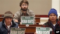 Immigrants working in the U.S. state of Vermont demonstrate at a legislative hearing for equal rights. 