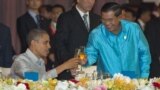 U.S. President Barack Obama, left, toasts with Cambodia's Prime Minister Hun Sen at the East Asia Summit Dinner during the East Asia Summit at the Diamond Island Convention Center in Phnom Penh, Cambodia, Monday, Nov. 19, 2012. (AP Photo/Carolyn Kaster)