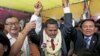 Meach Sovannara (C), a member of the Cambodia National Rescue Party cries next to CNRP President Sam Rainsy (L) and Deputy President Kem Sokha before a Buddhist ceremony at the CNRP office in Phnom Penh, Cambodia, April 13, 2015.