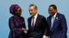 Senegal's Foreign Minister Yassine Fall, China's Foreign Minister Wang Yi and Republic of the Congo's Foreign Minister Jean-Claude Gakosso shake hands after a press conference in Beijing, Sept. 5, 2024. 