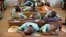 FILE - Muslim boys rest their heads on their desks during a language class at Al-Haramain madrassa at the Islamic Complex in Cameroon's capital Yaounde. Teachers, especially in the north, are afraid to return to their classrooms because of Boko Haram. 