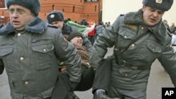 Russian police detain a participant during an opposition rally in Moscow, March 17, 2012.