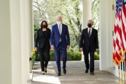 U.S. President Joe Biden speaks is flanked by Vice President Kamala Harris and Attorney General Merrick Garland as he arrives to announce executive actions on gun violence prevention.