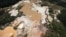 An aerial view of the environmental damage caused by illegal mining at the Canaima National Park in southern Bolivar State June 17, 2010. Venezuela's army has evicted thousands from makeshift towns in one of the world's most pristine jungles, where wildca