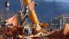 A general view shows the salvage operation of the Jeju Air Boeing 737-800 aircraft that crashed and burned at Muan International Airport in Muan, South Korea, Jan. 4, 2025. 