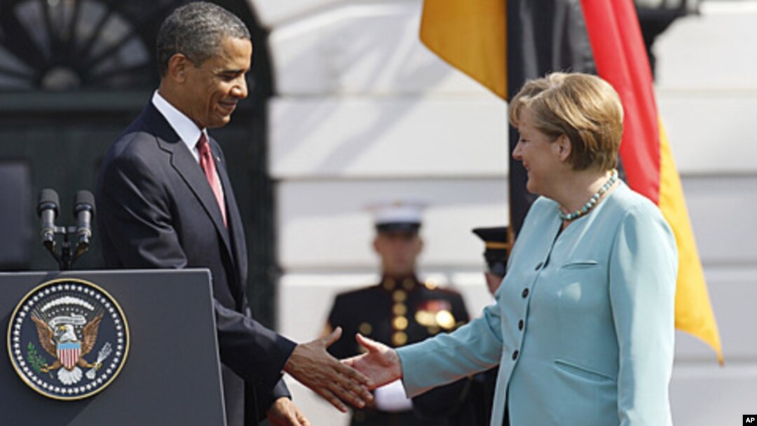 President Barack Obama shakes hands with German Chancellor Angela Merkel on the South Lawn at the White House in Washington, June 7, 2011.