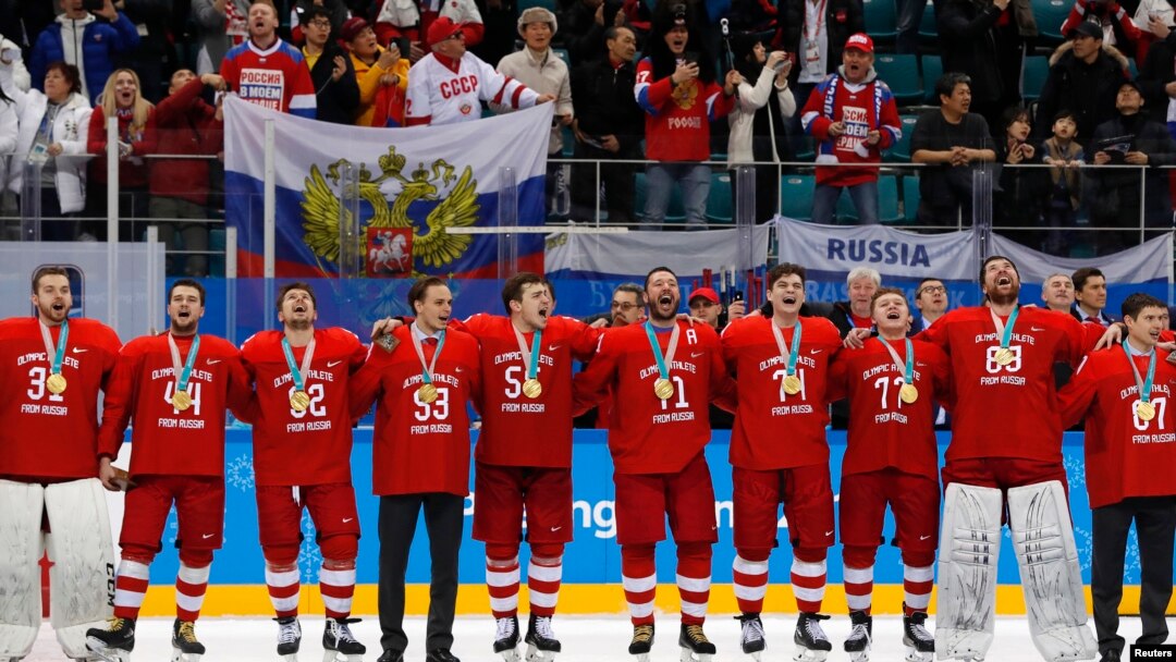 The Russian team sings their national anthem while wearing their gold medals.