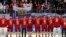 The Russian team sings their national anthem while wearing their gold medals.