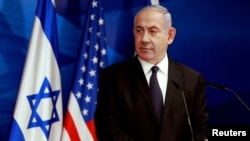 Israeli Prime Minister Benjamin Netanyahu looks at U.S. Secretary of State Anthony Blinken (not pictured) during a joint news conference in Jerusalem, May 25, 2021. 